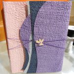 Album in carta di cotone interno avorio cm. 23x30 - 50 fogli, bottone angelo